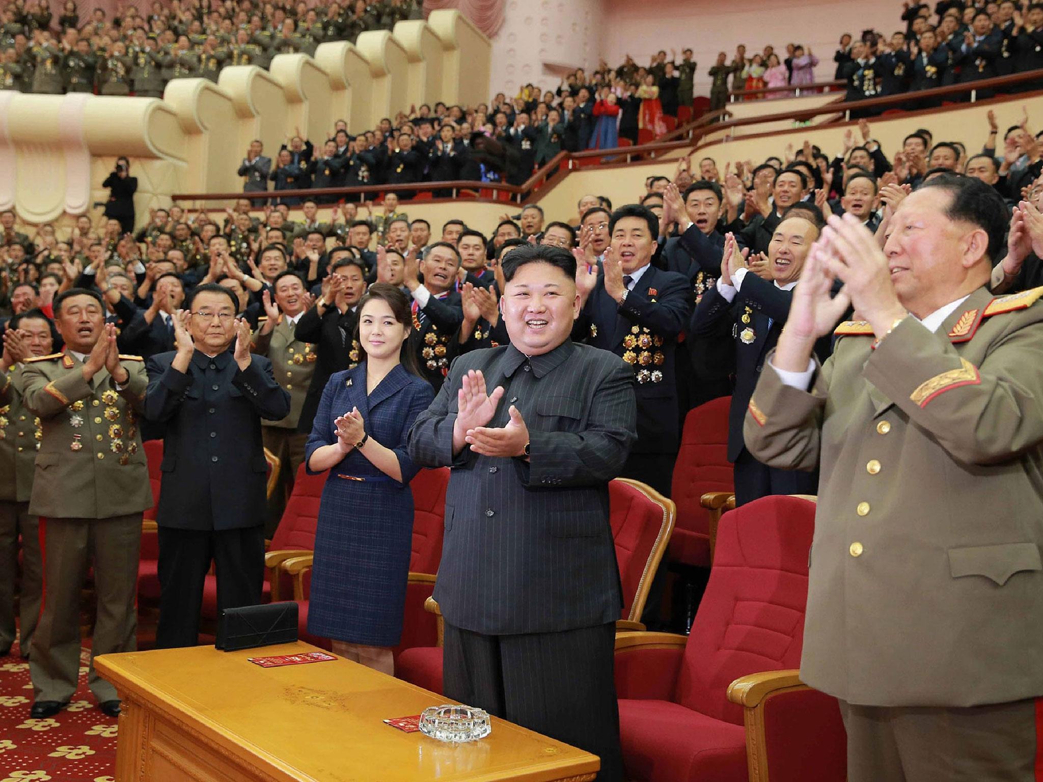 North Korean leader Kim Jong-Un and his wife Ri Sol-Ju attend an art performance dedicated to nuclear scientists and technicians, who worked on a hydrogen bomb which the regime claimed to have successfully tested, at the People's Theatre in Pyongyang