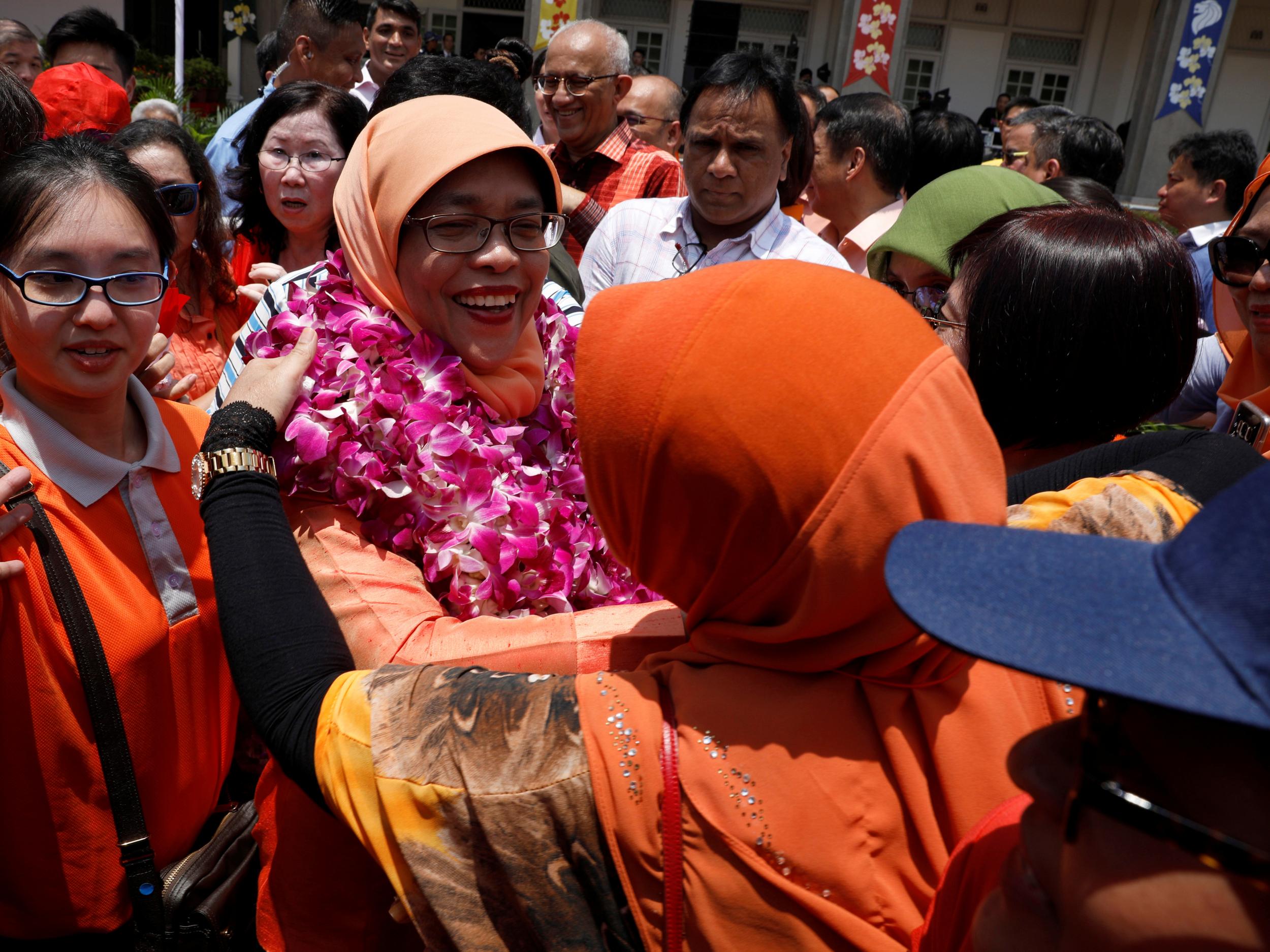 Singapore's President-elect Halimah Yacob leaves the nomination centre in Singapore