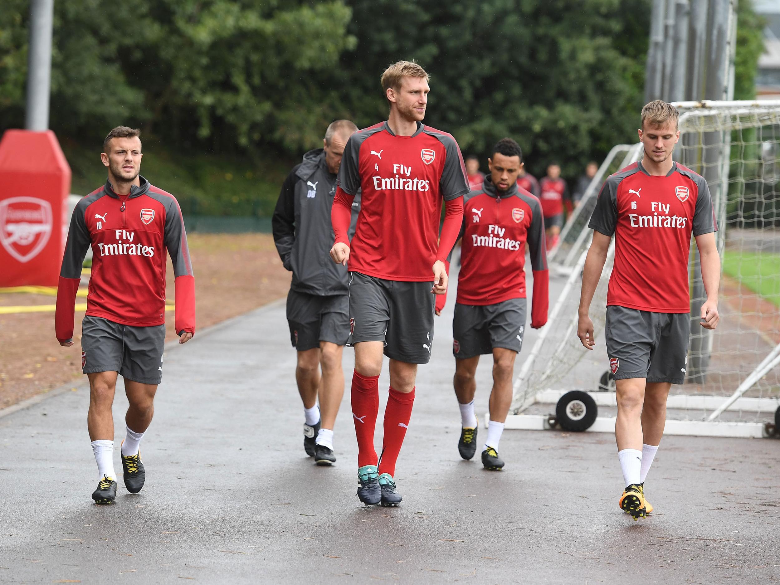 Arsenal's players take to the training field at their London Colney HQ