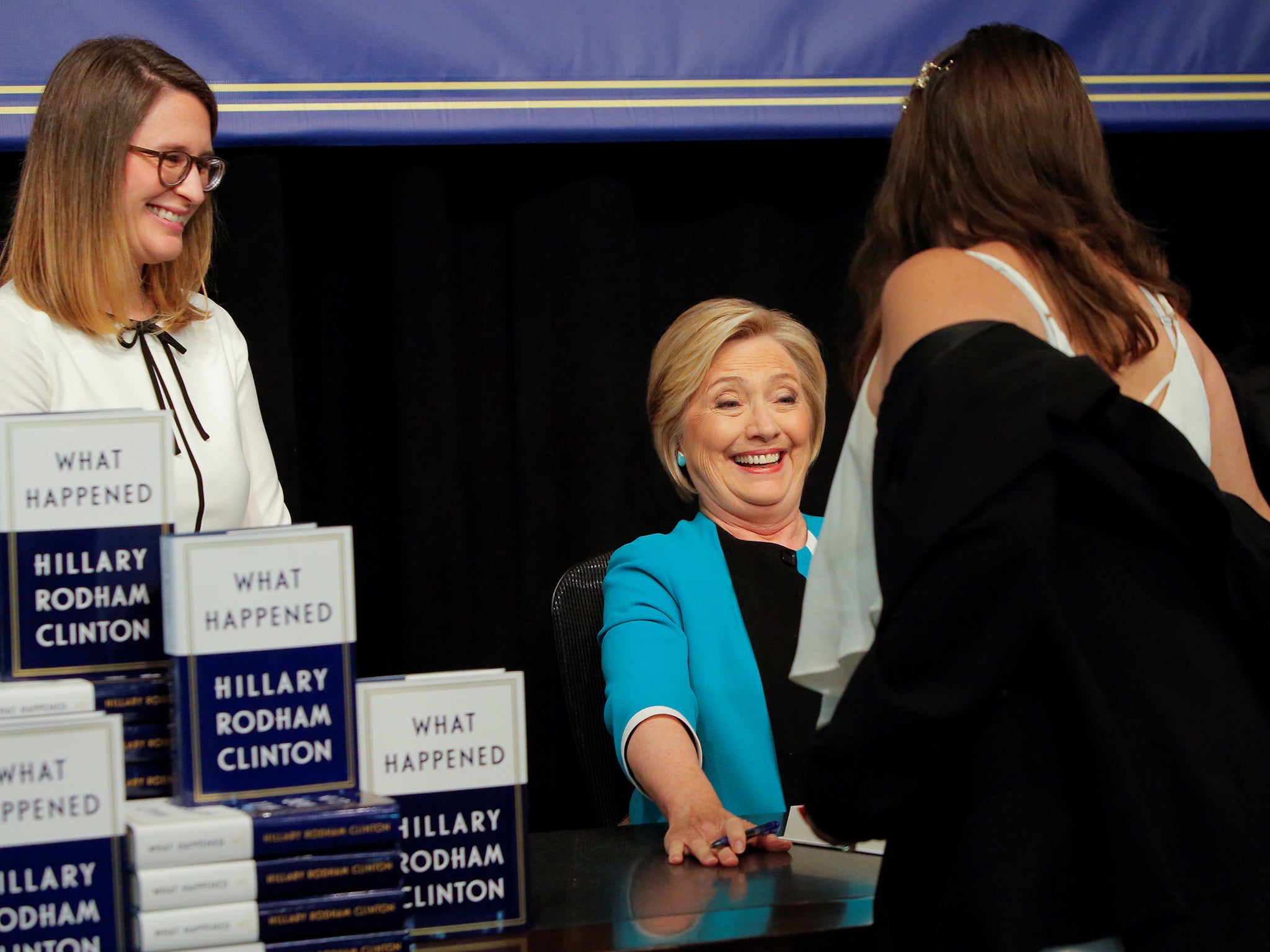 Former Secretary of State Hillary Clinton reacts at a signing of her new book 'What Happened' at Barnes & Noble bookstore at Union Square in Manhattan, New York