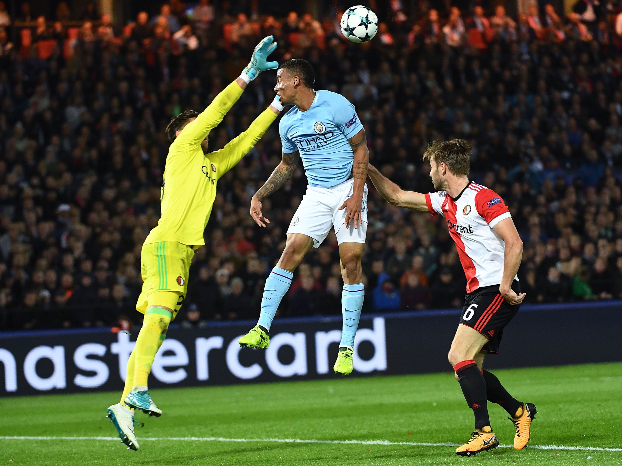 &#13;
Jesus jumps for a high ball with Feyenoord goalkeeper Brad Jones &#13;