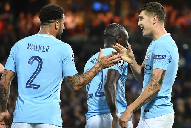 John Stones celebrates his second goal with Kyle Walker