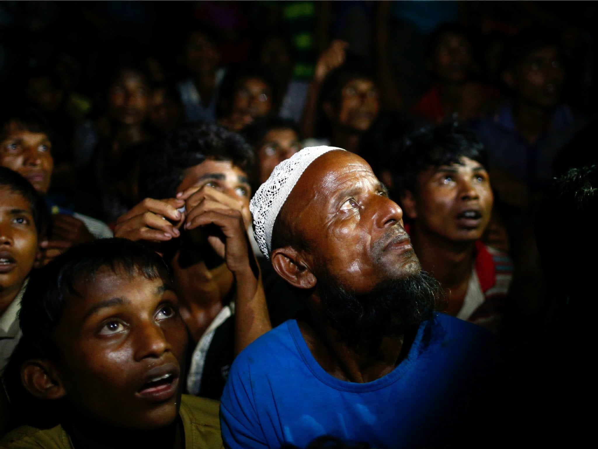 Rohingya refugees wait for food to be distributed by local organisations in Teknaf, Bangladesh
