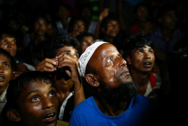 Rohingya refugees wait for food to be distributed by local organisations in Teknaf, Bangladesh