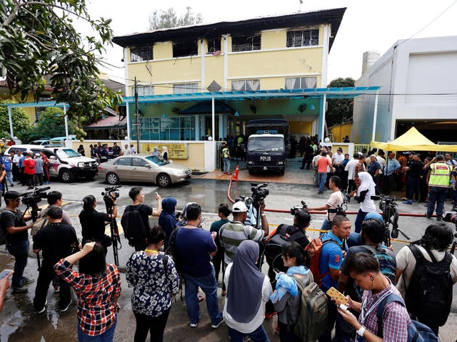 Media crowd outside the Darul Quran Ittifaqiyah religious school in Kuala Lumpur after the fire