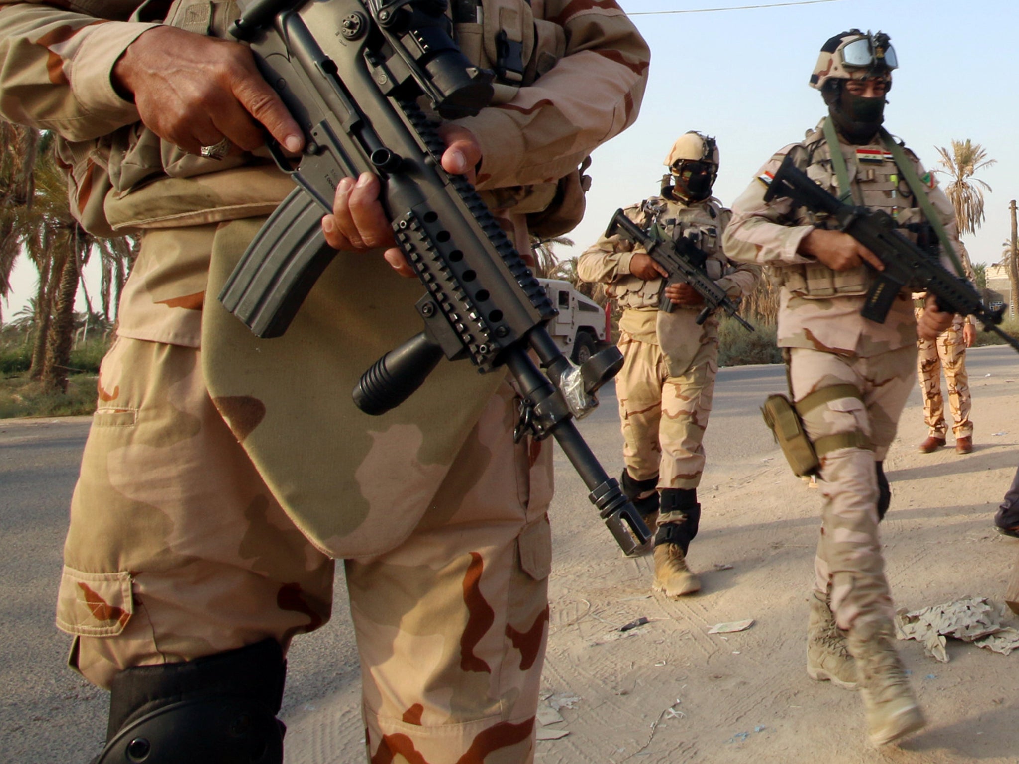 Iraqi army soldiers are seen in Al Karma, north of Basra, in this file photo