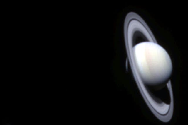 The planet Saturn is seen in the first color composite made of images taken by NASA's Cassini spacecraft on its approach to the ringed planet, October 21, 2002