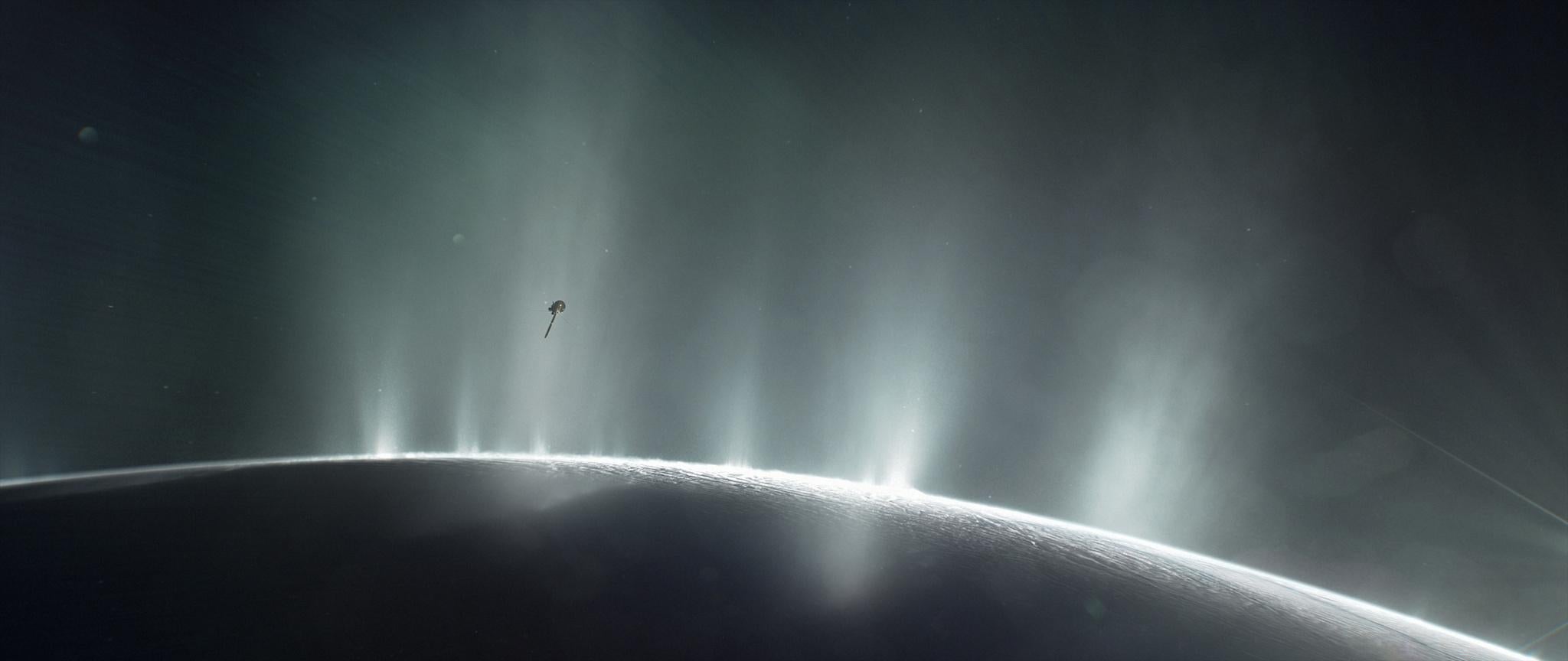 NASA's Cassini spacecraft is shown diving through the plume of Saturn's moon Enceladus, in 2015, in this photo illustration