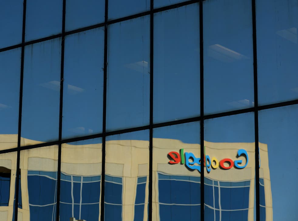 The Google logo is shown reflected on an adjacent office building in Irvine, California, U.S. August 7, 2017.