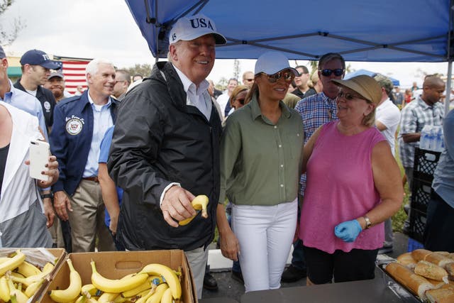 President Donald Trump and first lady Melania Trump talk and hand out food to people impacted by Hurricane Irma