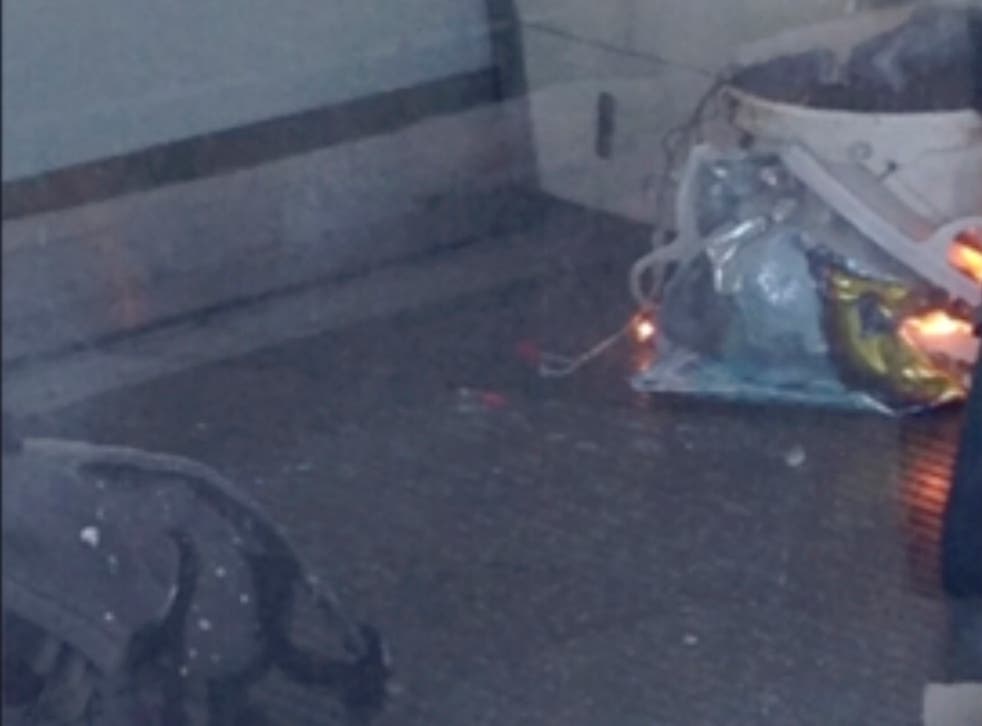 The bucket with wires trailing from it, pictured on the train after the blast