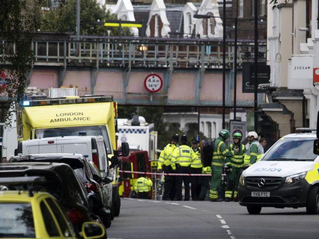 Emergency service workers near the crime scene at Parsons Green
