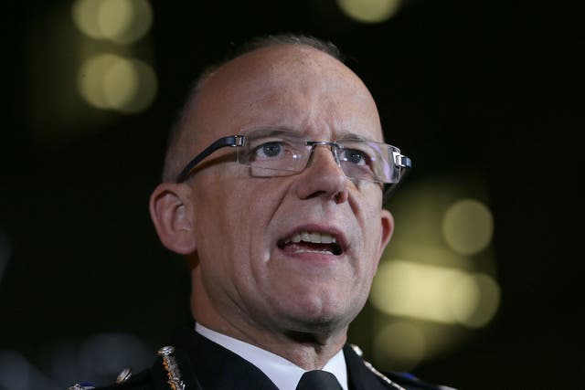 Assistant Commissioner Mark Rowley delivers a statement outside New Scotland Yard last night