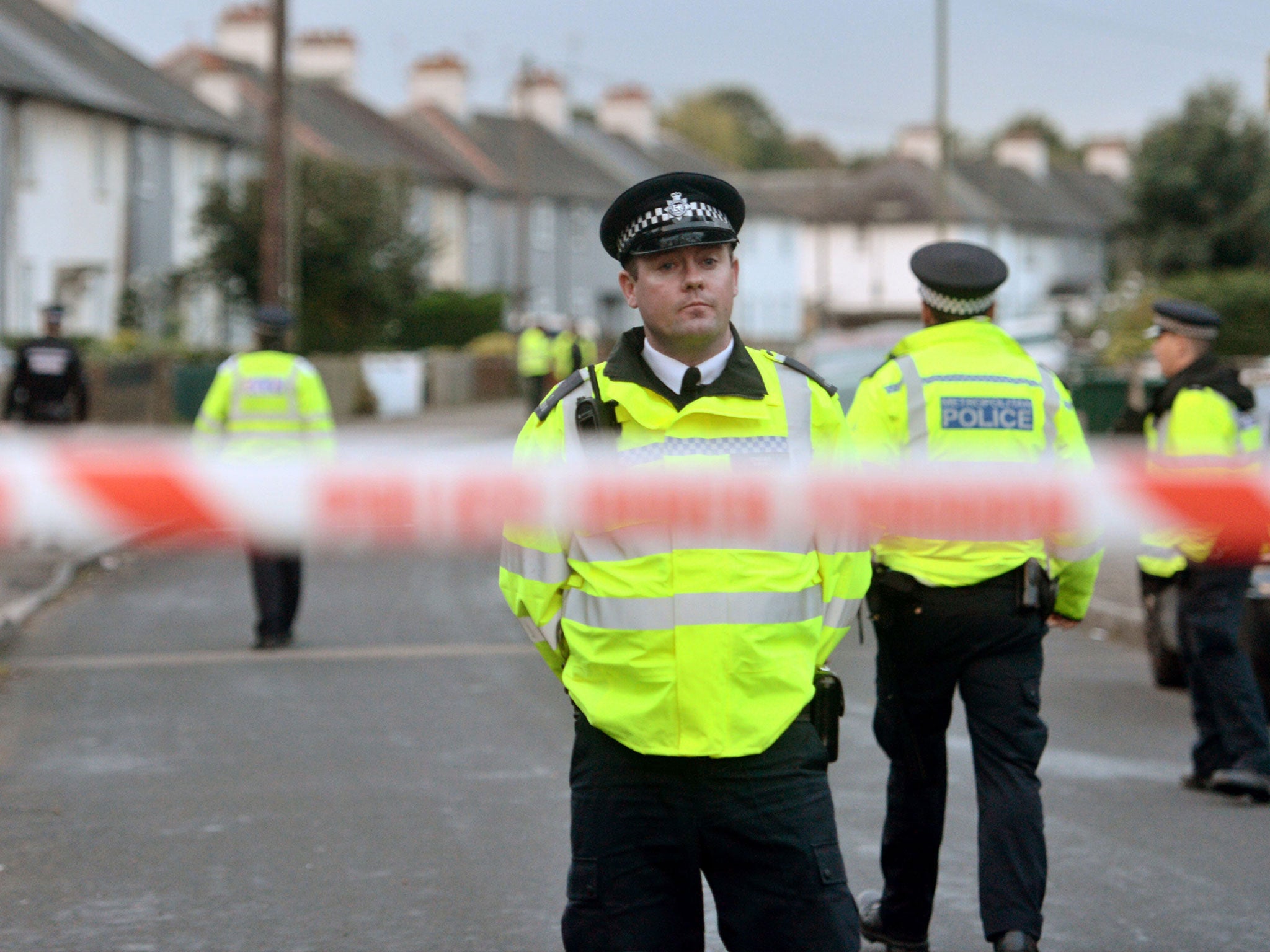 Police officers taking part in an operation in Cavendish Road, Sunbury-on-Thames, Surrey, as part of the investigation into the Parsons Green bombing