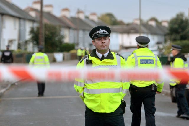 Police officers closed off a street in the Sunbury-on-Thames area, where Ahmed Hassan lived
