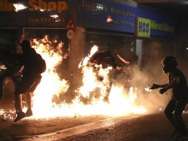 Molotov Cocktails explode at a rally in Athens