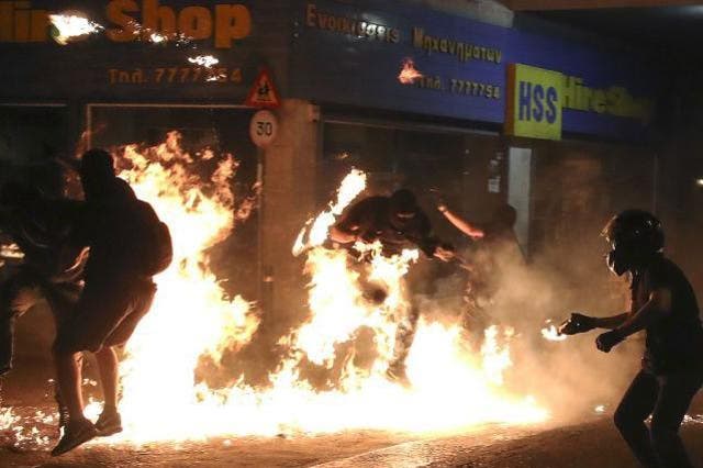 Molotov Cocktails explode at a rally in Athens