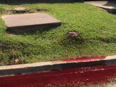 Blood and embalming fluid seeps onto street outside funeral home