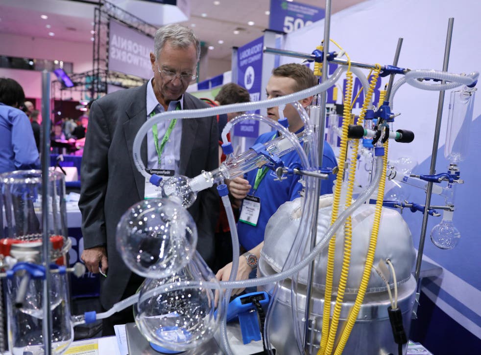 A man views a distillation system at the Cannabis World Congress & Business Exposition