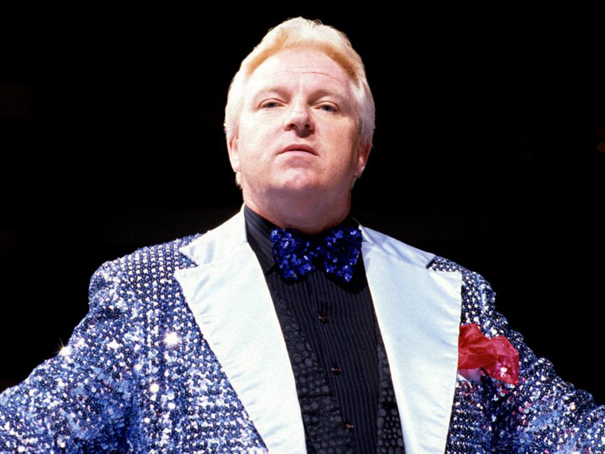 Heenan competed in the WWE along with his roles as a manager and commentator