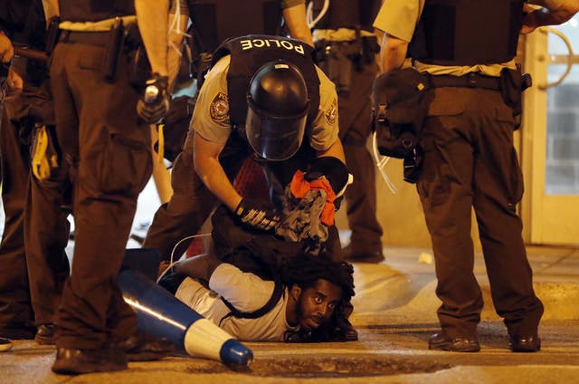 Police arrest a protester in St Louis