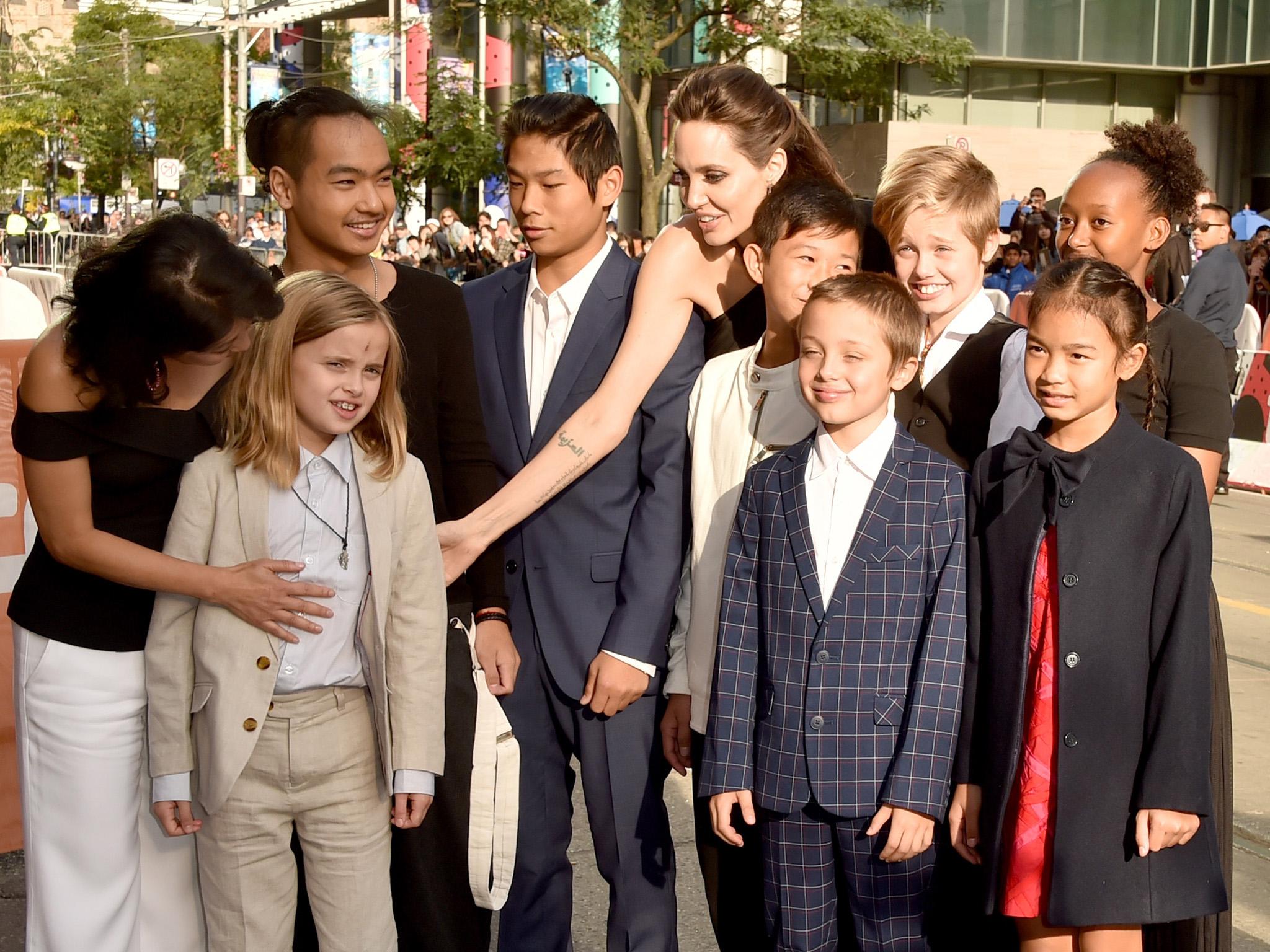 Friends and family attend the premiere of 'First They Killed My Father' at the Toronto film festival last week: (from left) Loung Ung, Vivienne, Maddox, Pax, Angelina, Kimhak Mun, Knox, Shiloh, Zahara and Sareum Srey Moch