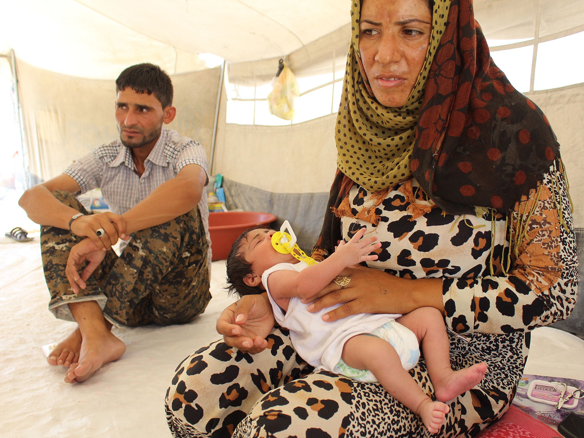 Amar Al Alil with his wife Delal Hussein and their three-week-old Aaia