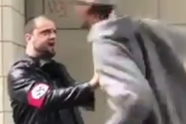 A man wearing a swastika armband was caught on video being punched in downtown Seattle