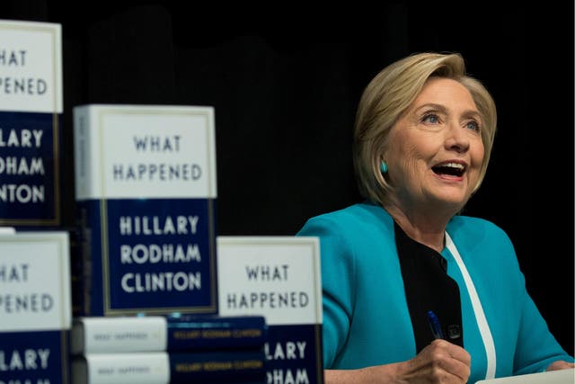 Former US Secretary of State Hillary Clinton signs copies of her new book 'What Happened' during a signing event at Barnes and Noble bookstore in New York City on 12 September 2017.