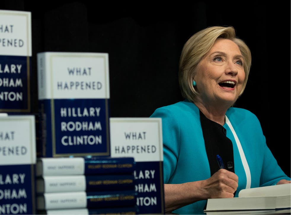 Former US Secretary of State Hillary Clinton signs copies of her new book 'What Happened' during a signing event at Barnes and Noble bookstore in New York City on 12 September 2017.