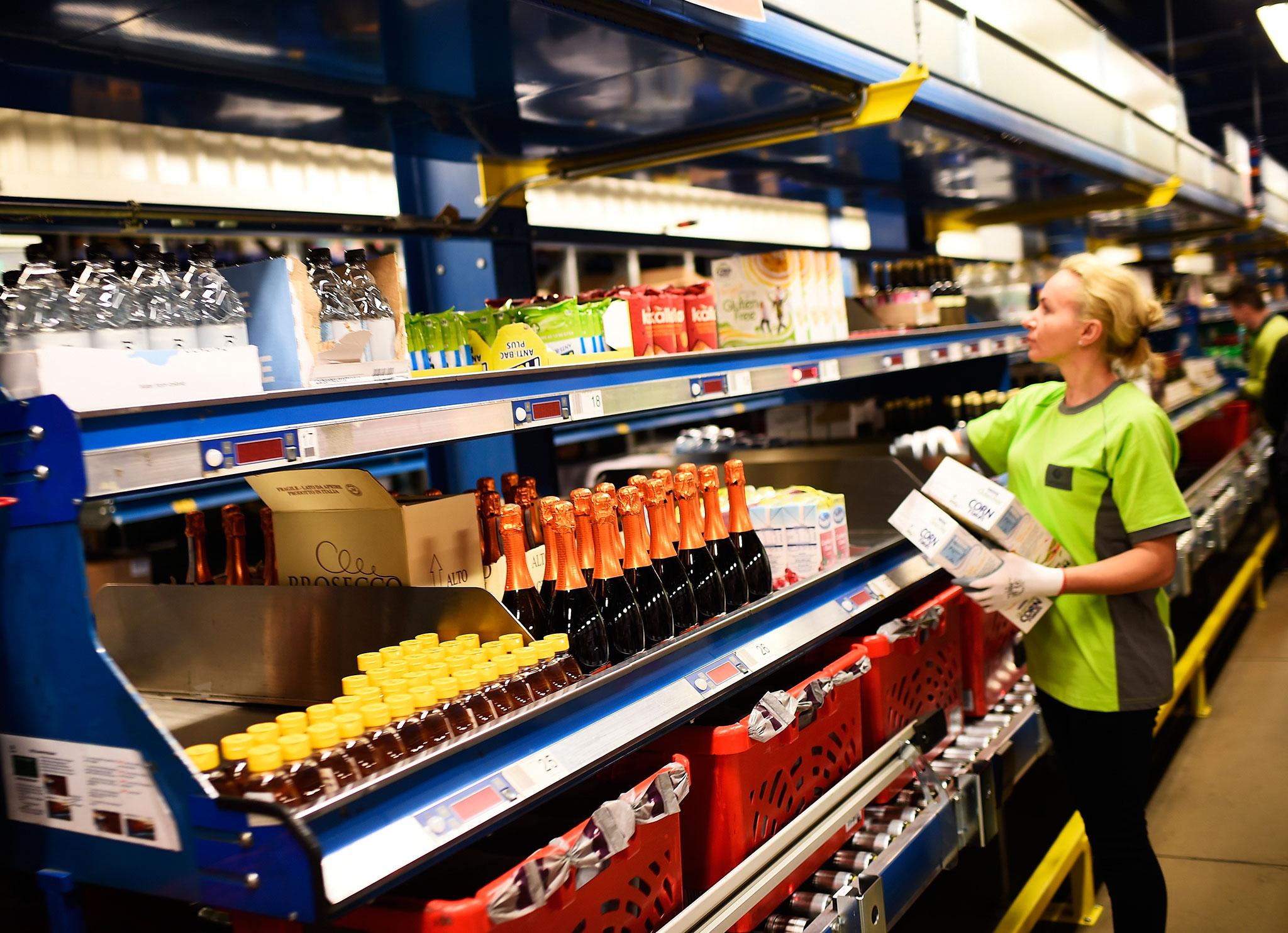 An Ocado worker eyes the shelves at one of its fulfilment centres