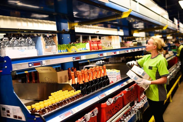 An Ocado worker eyes the shelves at one of its fulfilment centres 