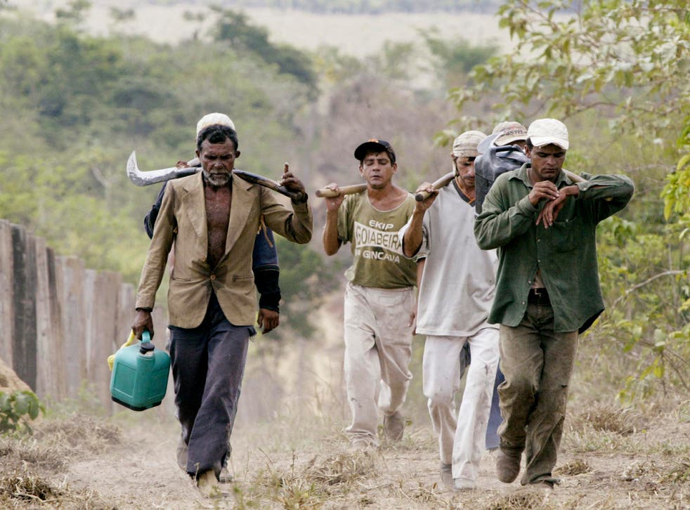Brazilian slave labourers return from a day of work cutting down forest on the Bom Jesus farm in the Amazon Basin