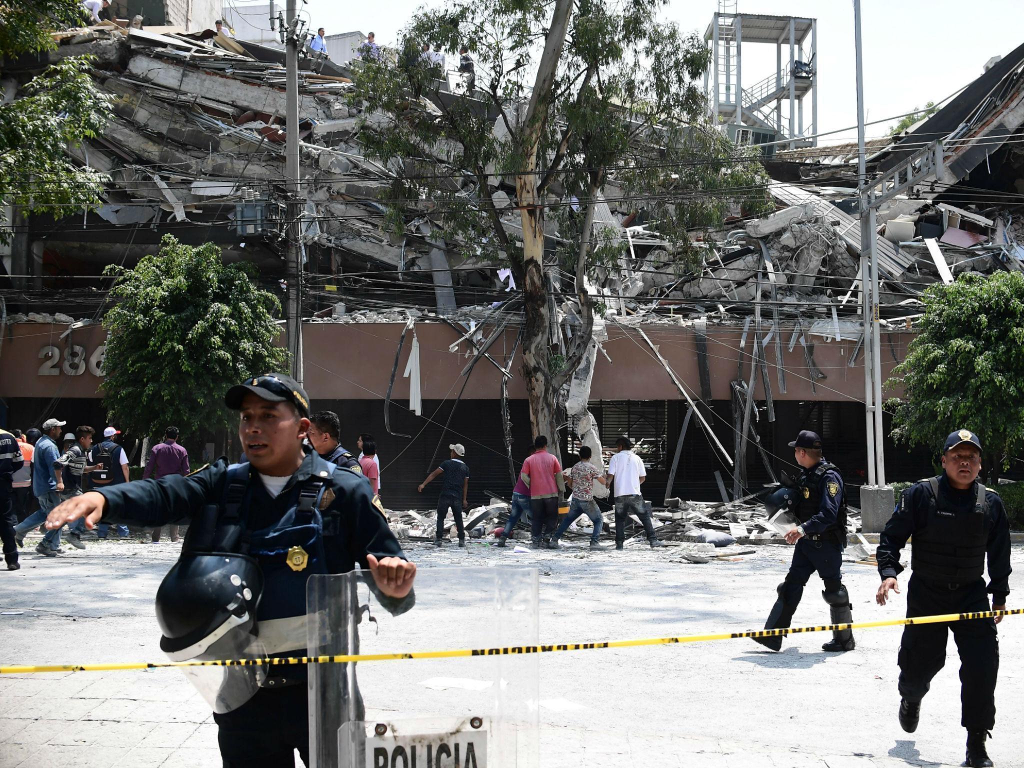 An injured woman is pictured in Mexico City after a 7.1 magnitude earthquake