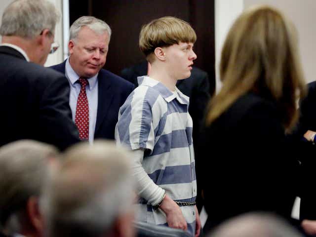 Dylann Roof is escorted into the court room at Charleston County Judicial Center to enter a guilty plea on murder charges for the 2015 shooting massacre at a historic black church in Charleston, South Carolina, on 10 April 2017