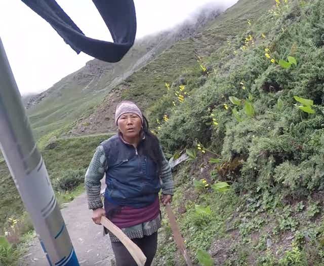 A British tourist was chased along a mountain path by a local after complaining about tea prices