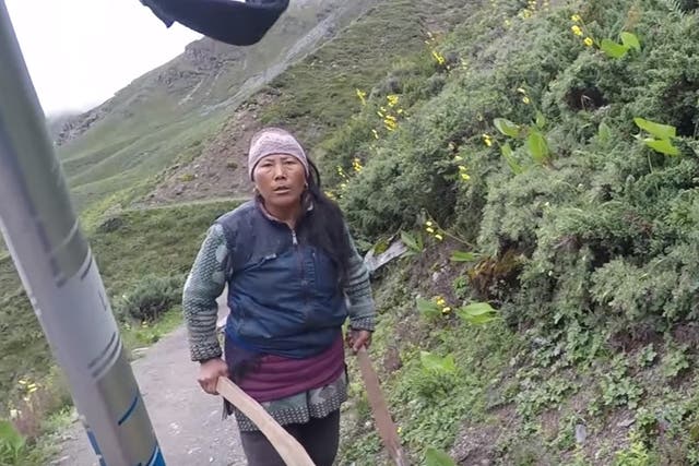 A British tourist was chased along a mountain path by a local after complaining about tea prices