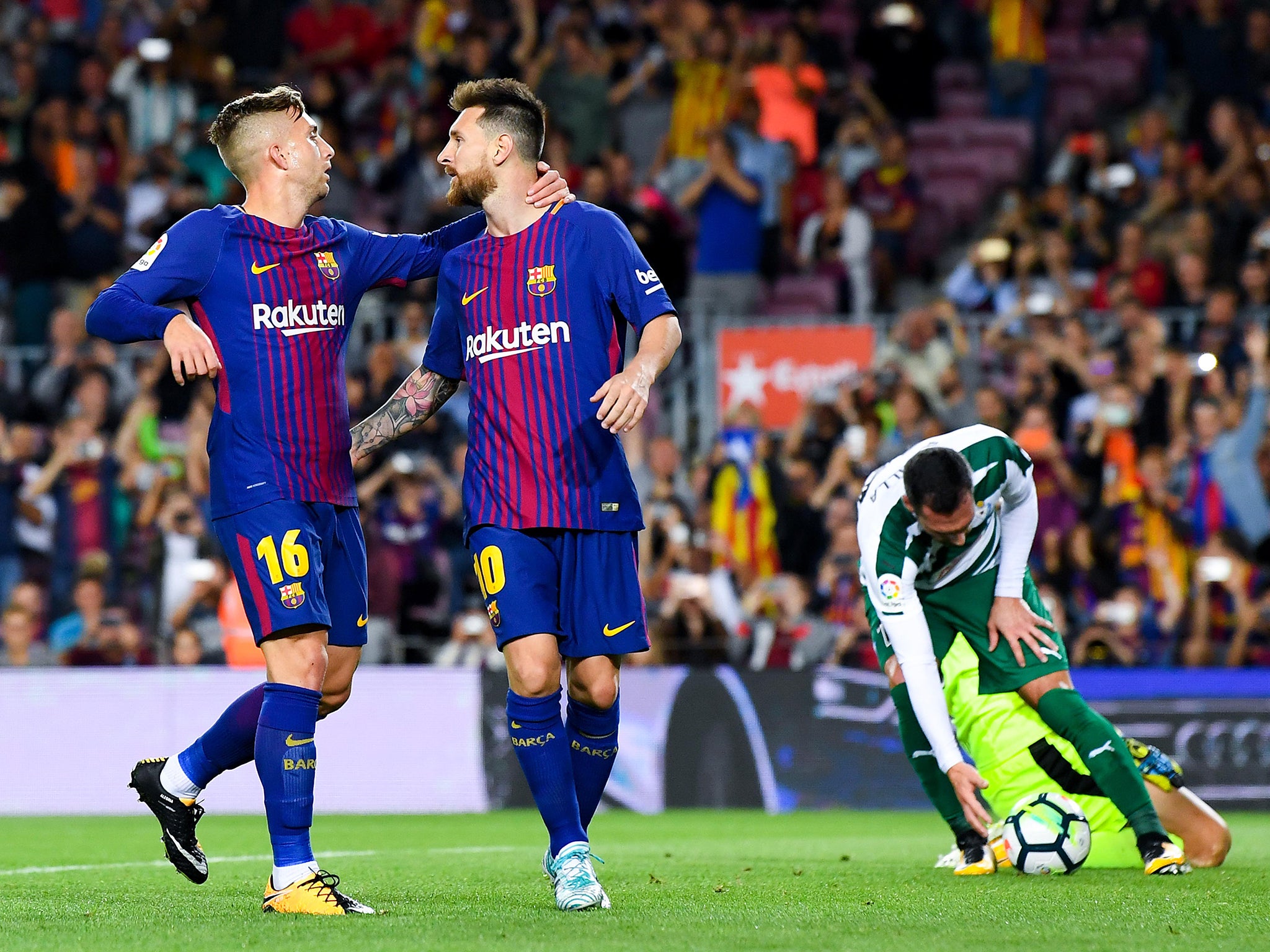 Messi celebrates with Gerard Deulofeu after scoring his fourth goal