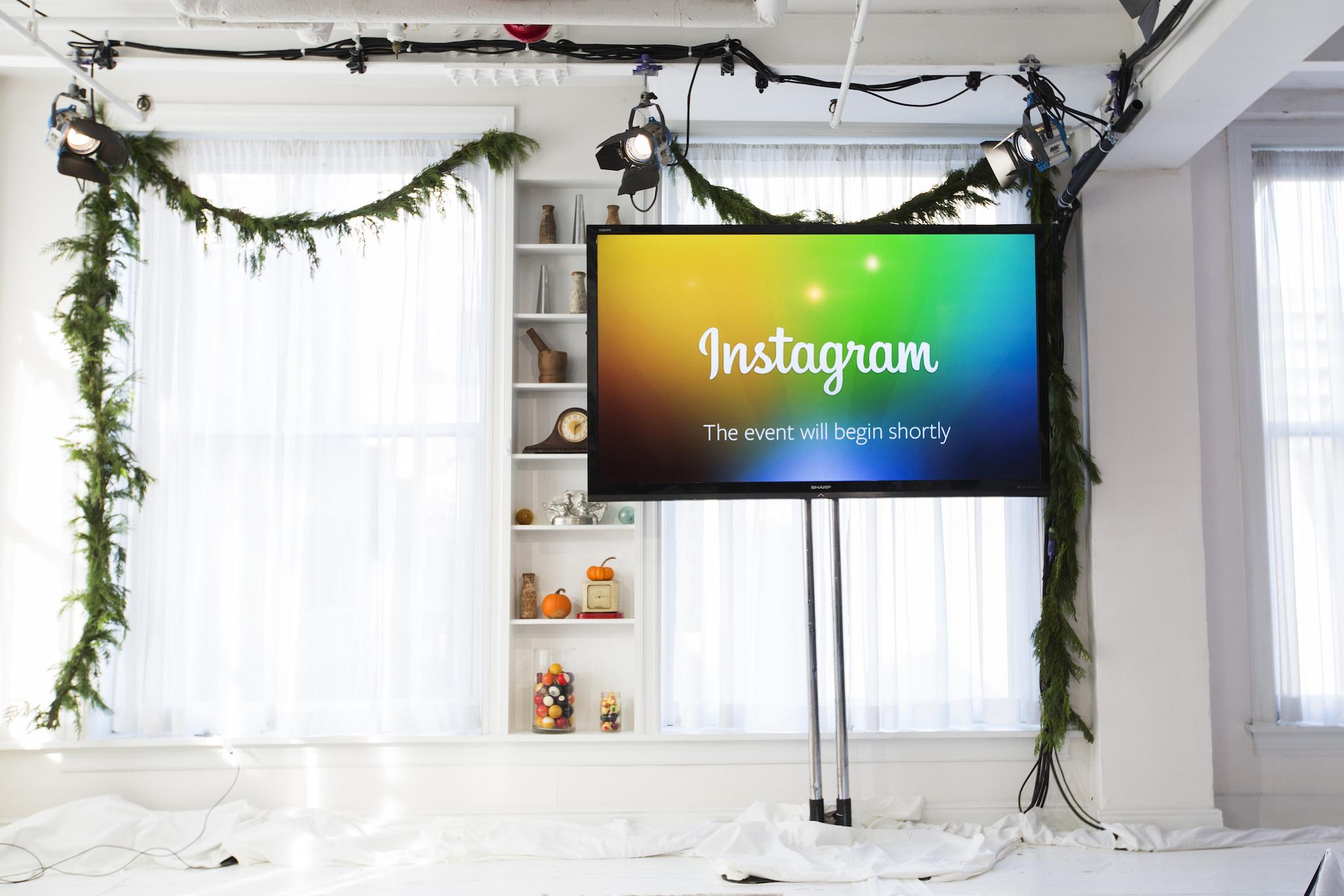 A screen displays a "This event will begin shortly" message before Instagram Chief Executive Officer and co-founder Kevin Systrom announces the launch of a new service named Instagram Direct in New York December 12, 2013