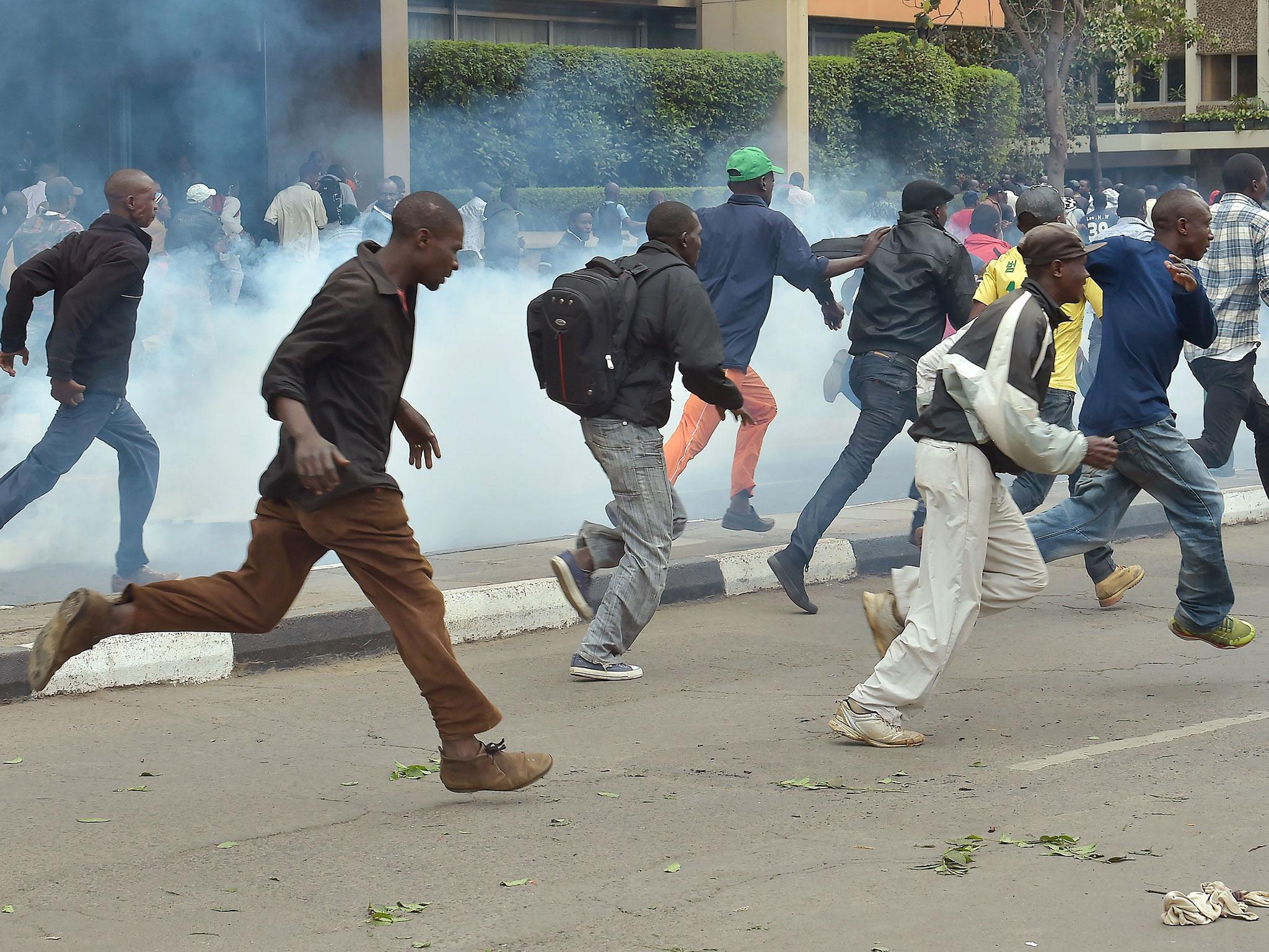 Police fire tear gas on demonstrators outside the Supreme Court in Nairobi during the delivery of a detailed ruling laying out the court’s reasons for annulling last month’s presidential election