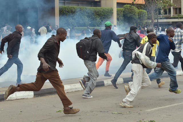 Police fire tear gas on demonstrators outside the Supreme Court in Nairobi during the delivery of a detailed ruling laying out the court’s reasons for annulling last month’s presidential election