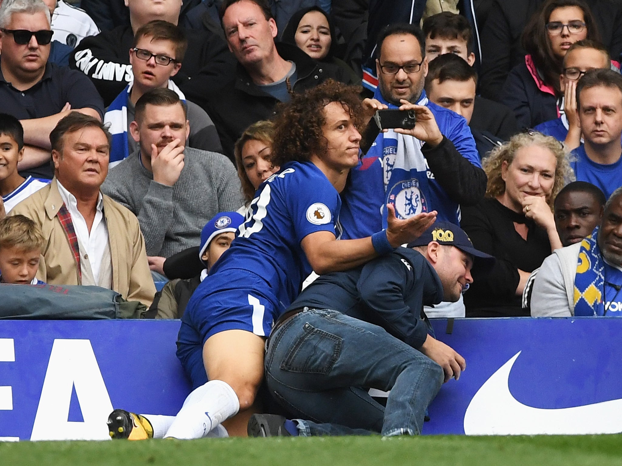 David Luiz broke his wrist after colliding with an advertising hoarding