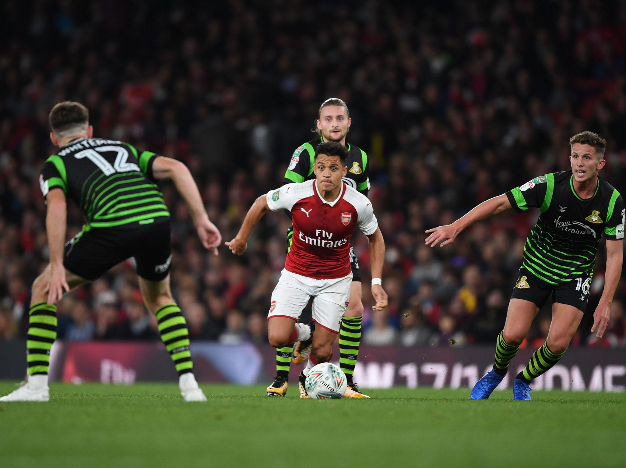 
Sanchez played as Arsenal scraped past Doncaster 
