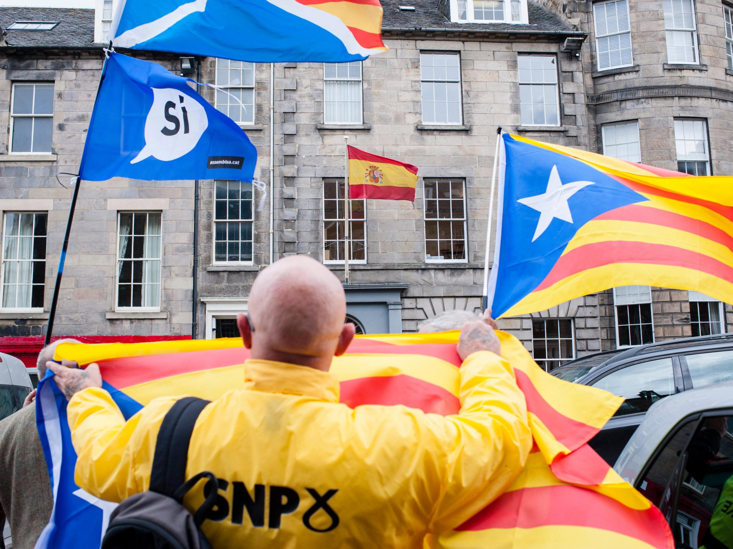 People protest against the actions of the Spanish government in front of the Spanish consulate in Edinburgh. Spanish police stormed ministries and buildings belonging to Catalonia's regional government yesterday, in an attempt to try and put a stop to the region's independence referendum