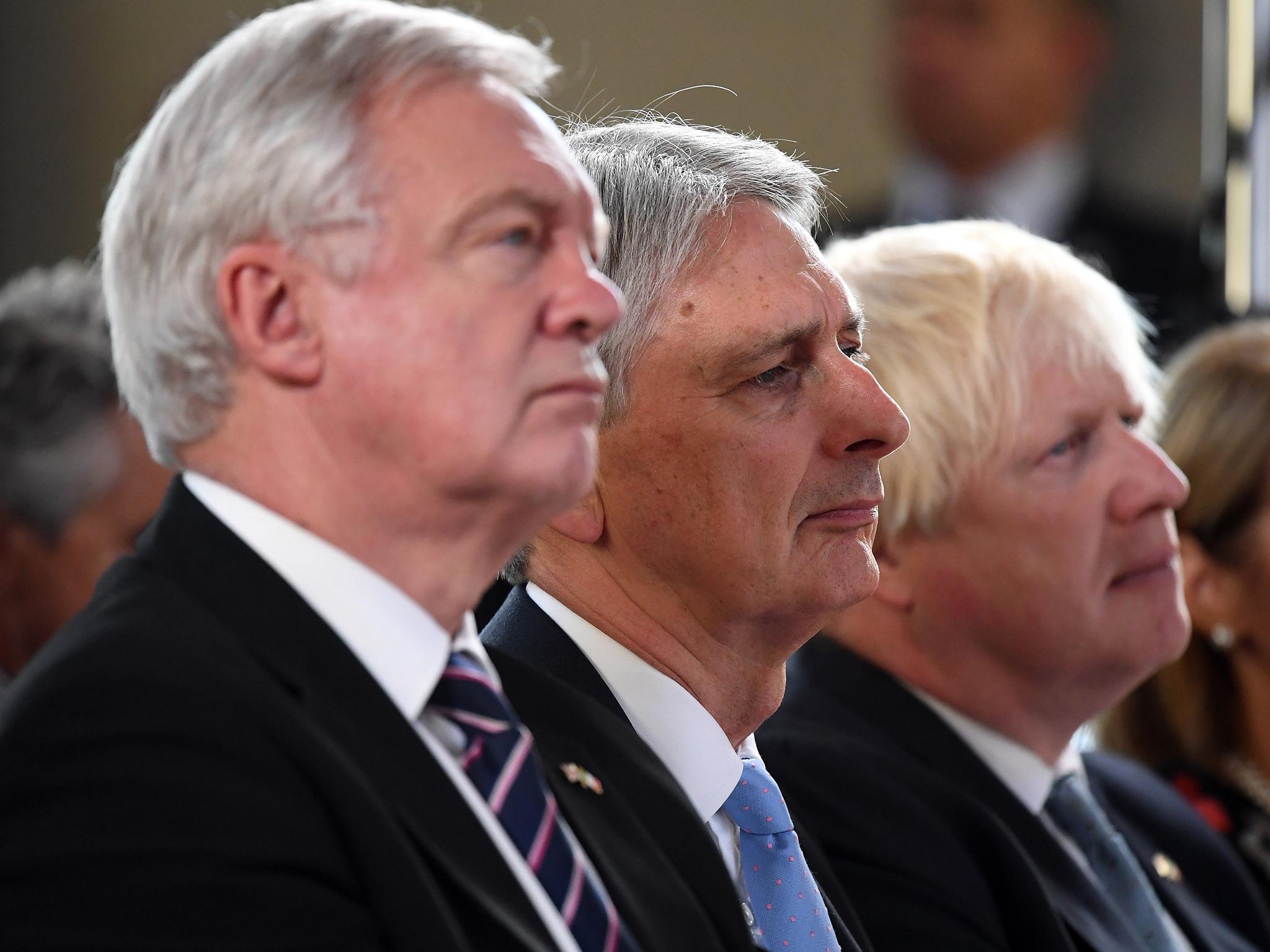 David Davis, Philip Hammond and Boris Johnson listen with intent to Theresa May's Brexit speech