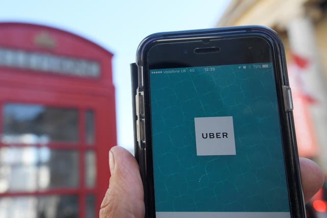 A photo illustration shows the Uber app logo displayed on a mobile telephone, as it is held up for a posed photograph in central London September 22, 2017