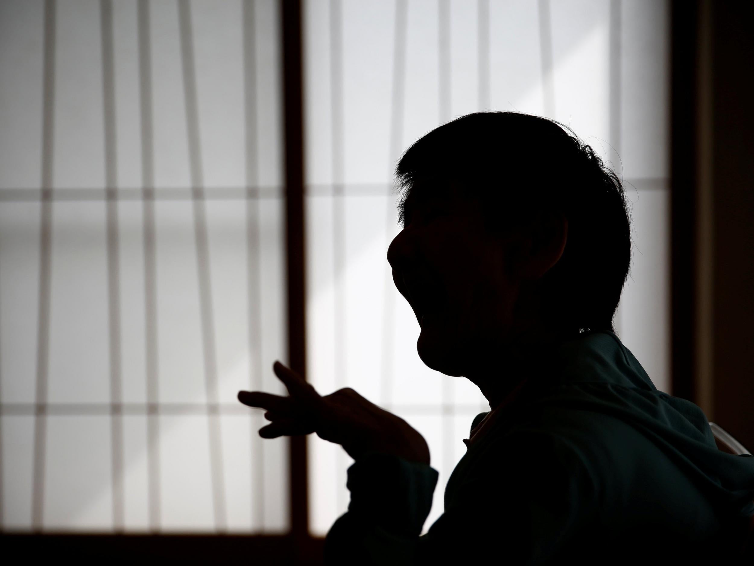 Shinobu Sakamoto, 61, speaks to middle school students about the Minamata disease