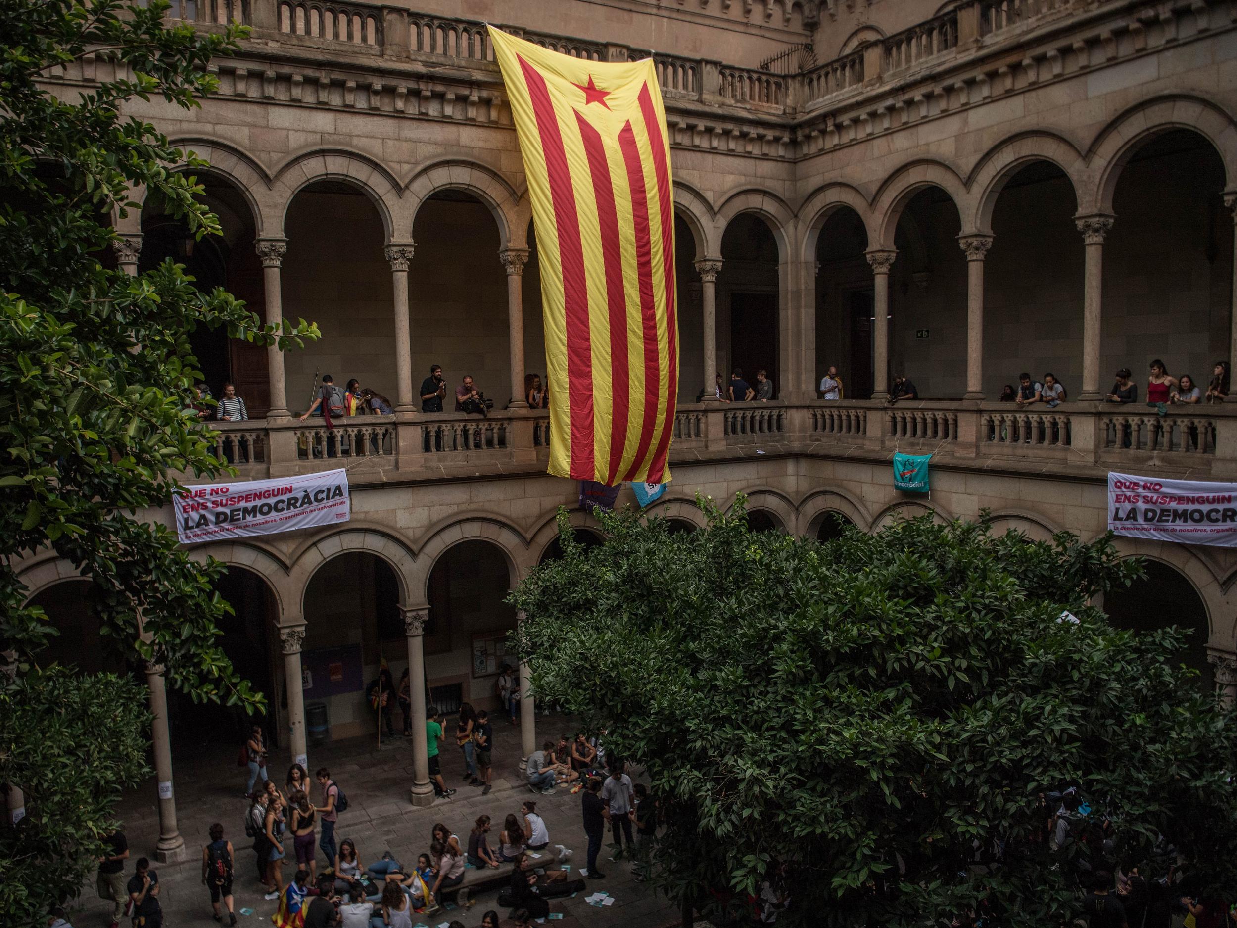 A Catalan pro-independence flag hangs inside the rectory of the University of Barcelona during a protest on Friday (David Ramos/Getty)