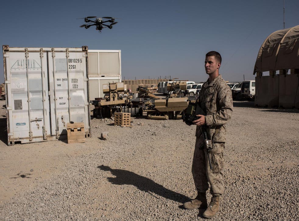US Marine Corporal Isaac Brown, from Virginia, operates a surveillance drone which provides base security on September 10, 2017 at Camp Shorab in Helmand Province, Afghanistan