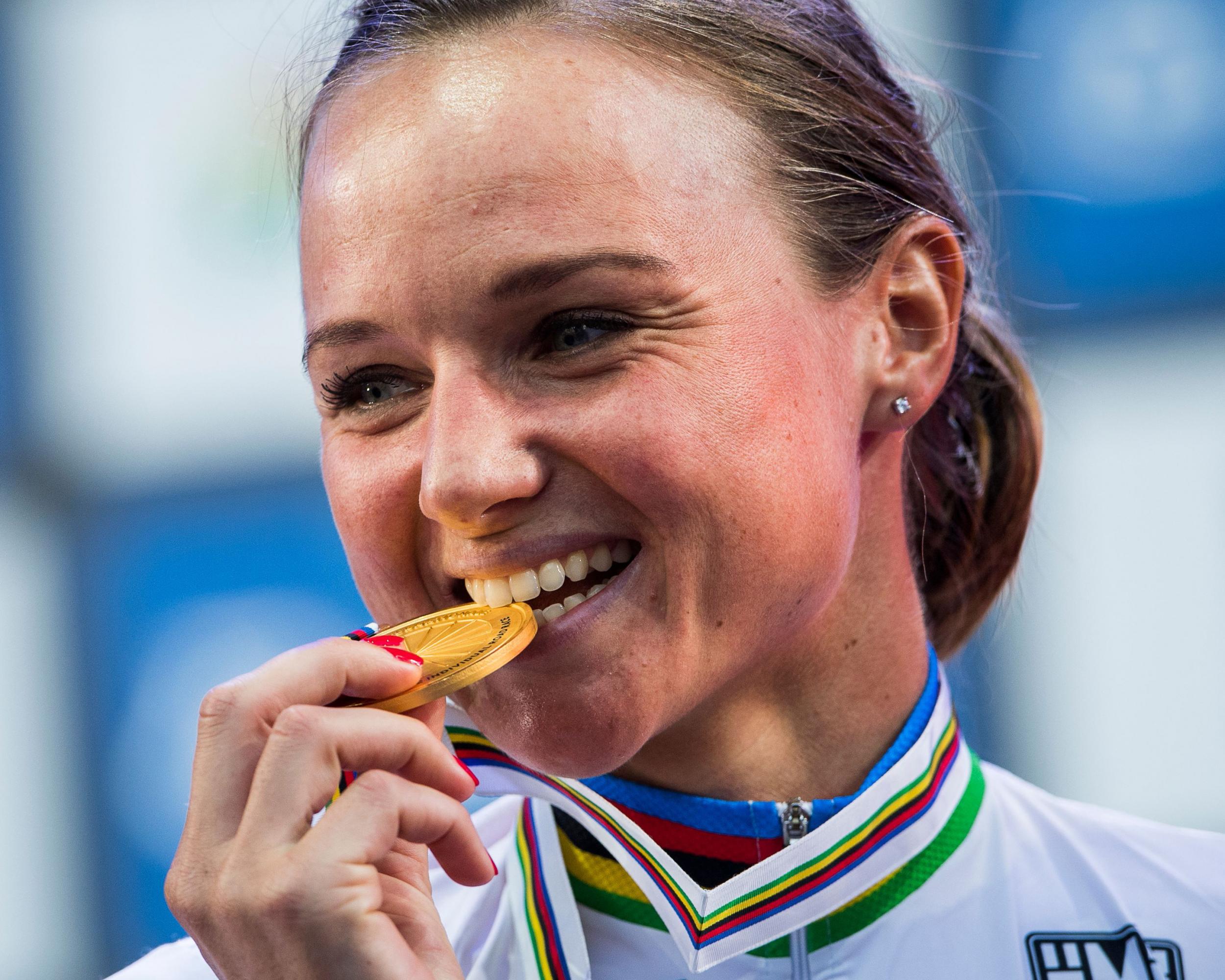 Chantal Blaak poses with her medal after winning the women's elite road race